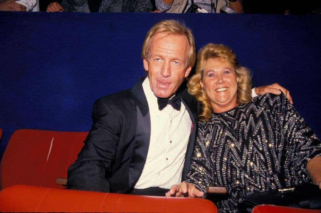 Paul Hogan holds an arm around wife Noelene's shoulders at a screening of Crocodile Dundee 2.