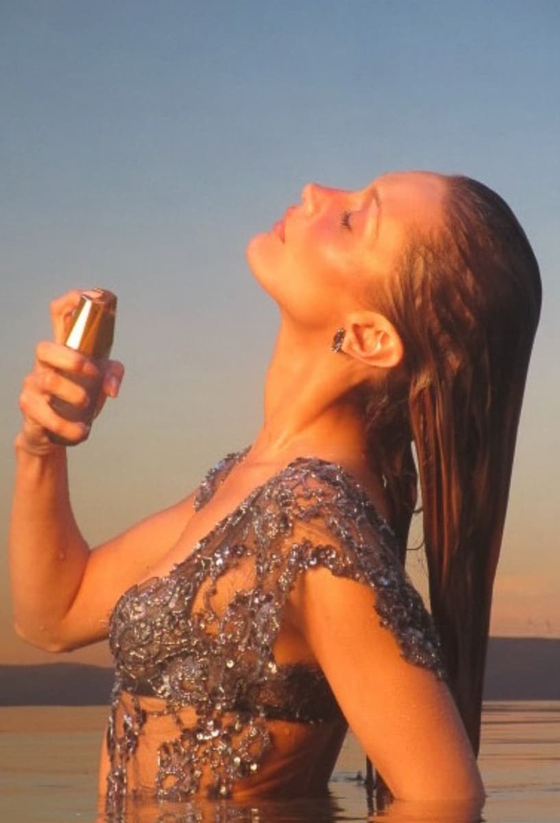 Bella Hadid is back with a new campaign, showcasing her stunning figure in a daring, high-shine ensemble for the latest photoshoot promoting her fragrance brand, Ôrəbella.