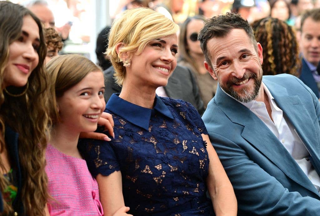 US actor Noah Wyle sits with his wife Sara Wells and daughters Auden Wyle (L) and Frances Harper Wyle (2L) during his Walk of Fame star ceremony
