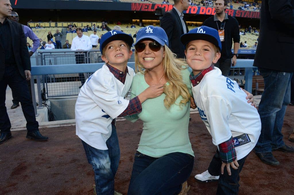  Britney Spears poses with sons Jayden James Federline (L) and Sean Preston Federline (R) during a game against the San Diego Padres at Dodger Stadium on April 17, 2013 in Los Angeles, California
