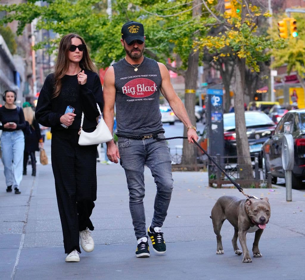 Justin Theroux and Nicole Brydon Bloom with his dog 
