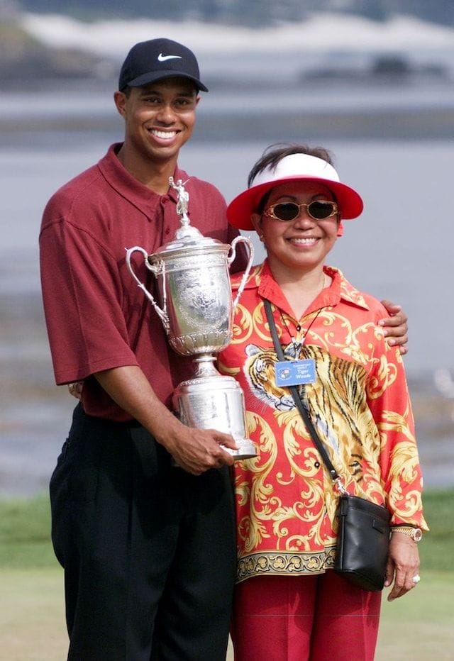 Tiger Woods celebrating one of his awards with his mother.