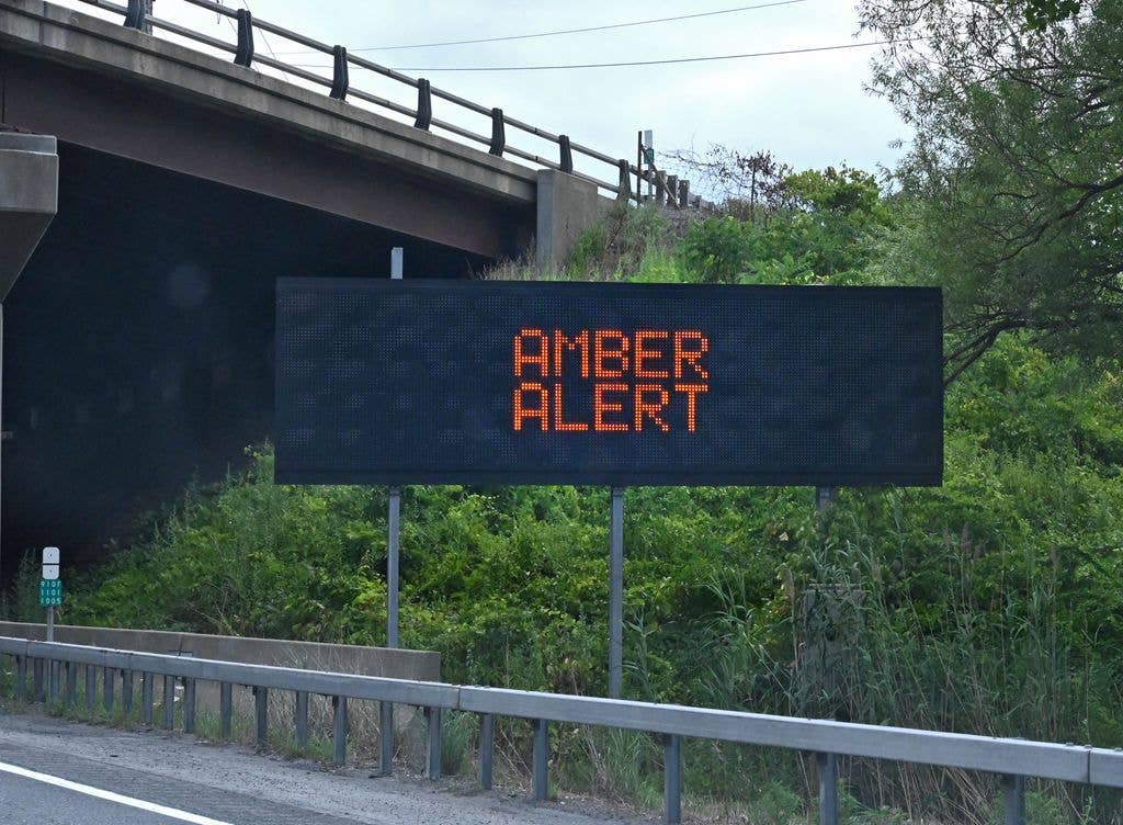 An electric road sign along I-87 northbound scrolls the messages Amber Alert and call 511 on Sunday, July 20, 2025, in Colonie, N.Y. Police sent an alert to people's phones saying Melina Galanis Frattolin was last seen southbound in a white van on I-87 near exit 22 at 9:40 p.m. Saturday.