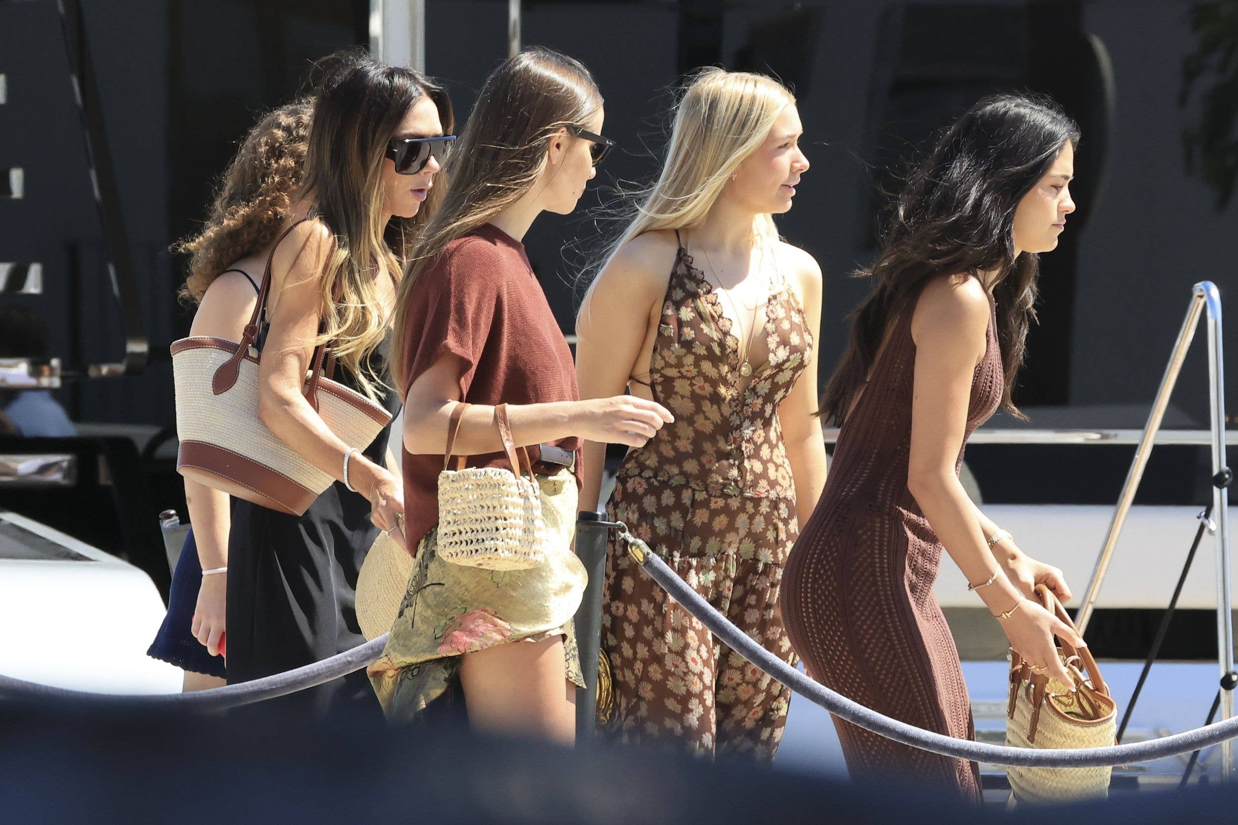 Victoria Beckham stepped out during a family holiday in Ibiza to enjoy a beach day alongside daughter Harper Seven, son Romeo and his girlfriend Kim Turnbull and all without David Beckham who presumably stayed away.