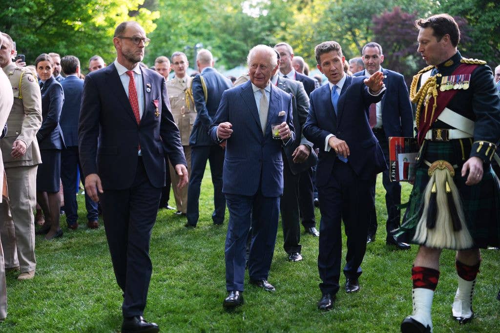 Lieutenant Colonel Johnny Thompson at garden party with king charles