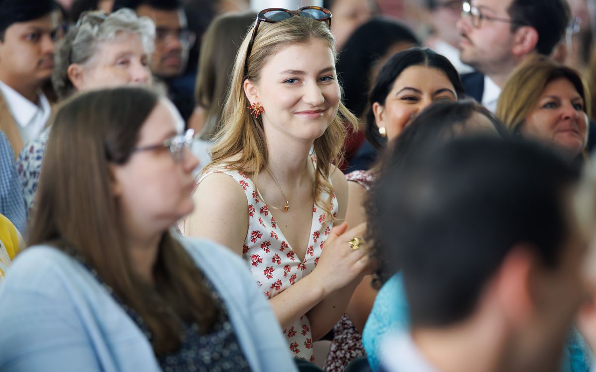 The Belgian heir to the throne looked elegant in a red-and-white printed dress during Harvard graduation festivities.