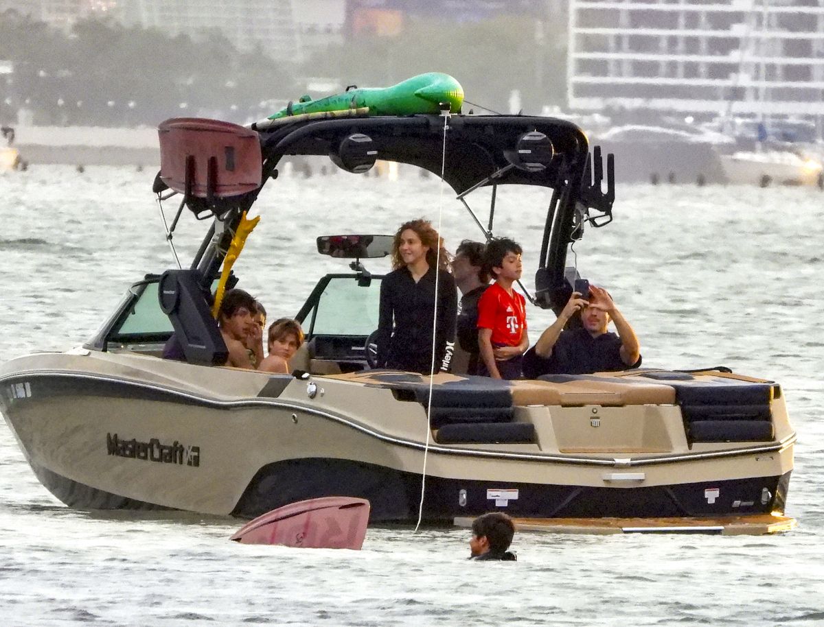 The boat itself was packed with watersports gear, including colorful boards secured overhead.