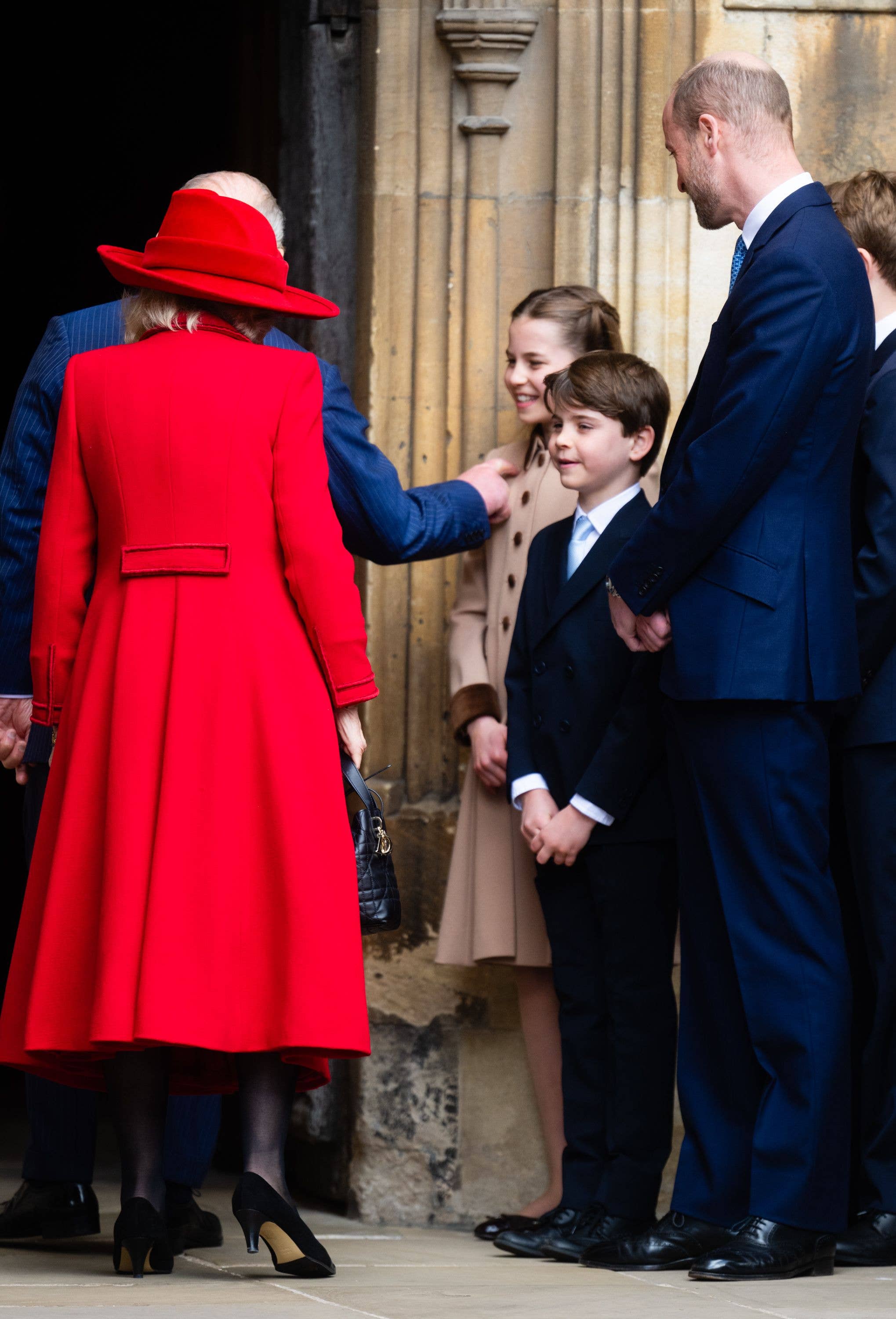 King Charles III and Queen Camilla greet Princess Charlotte of Wales, Prince Louis of Wales and Prince William, Prince of Wales 