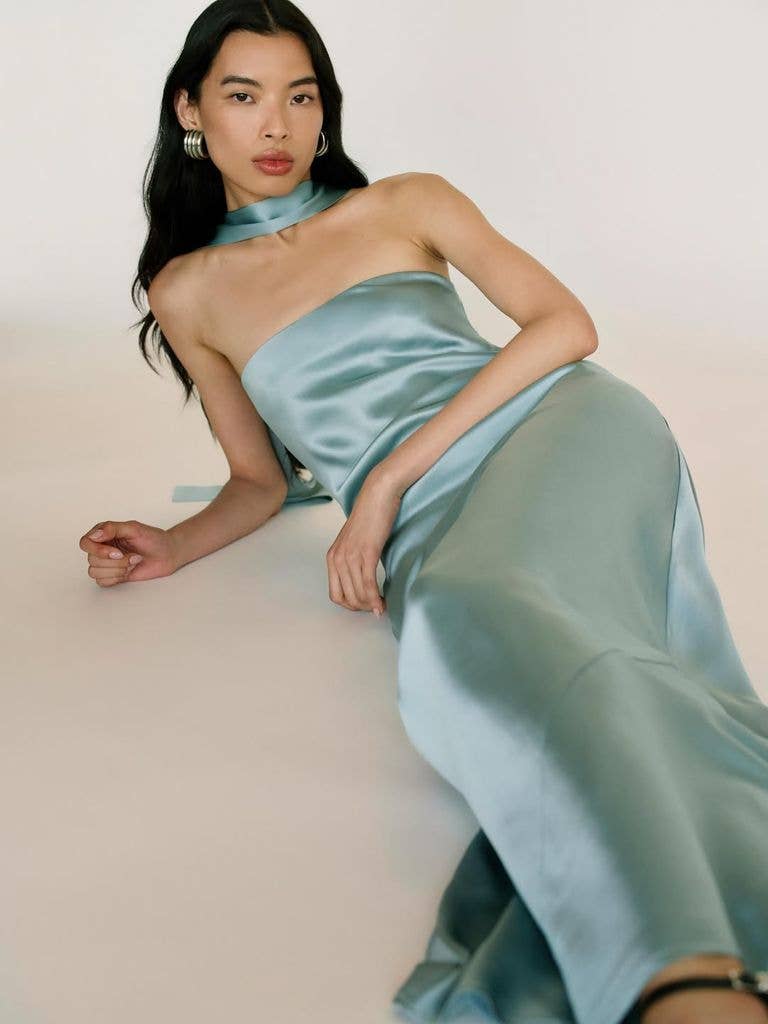 Reformation brand model in blue dress