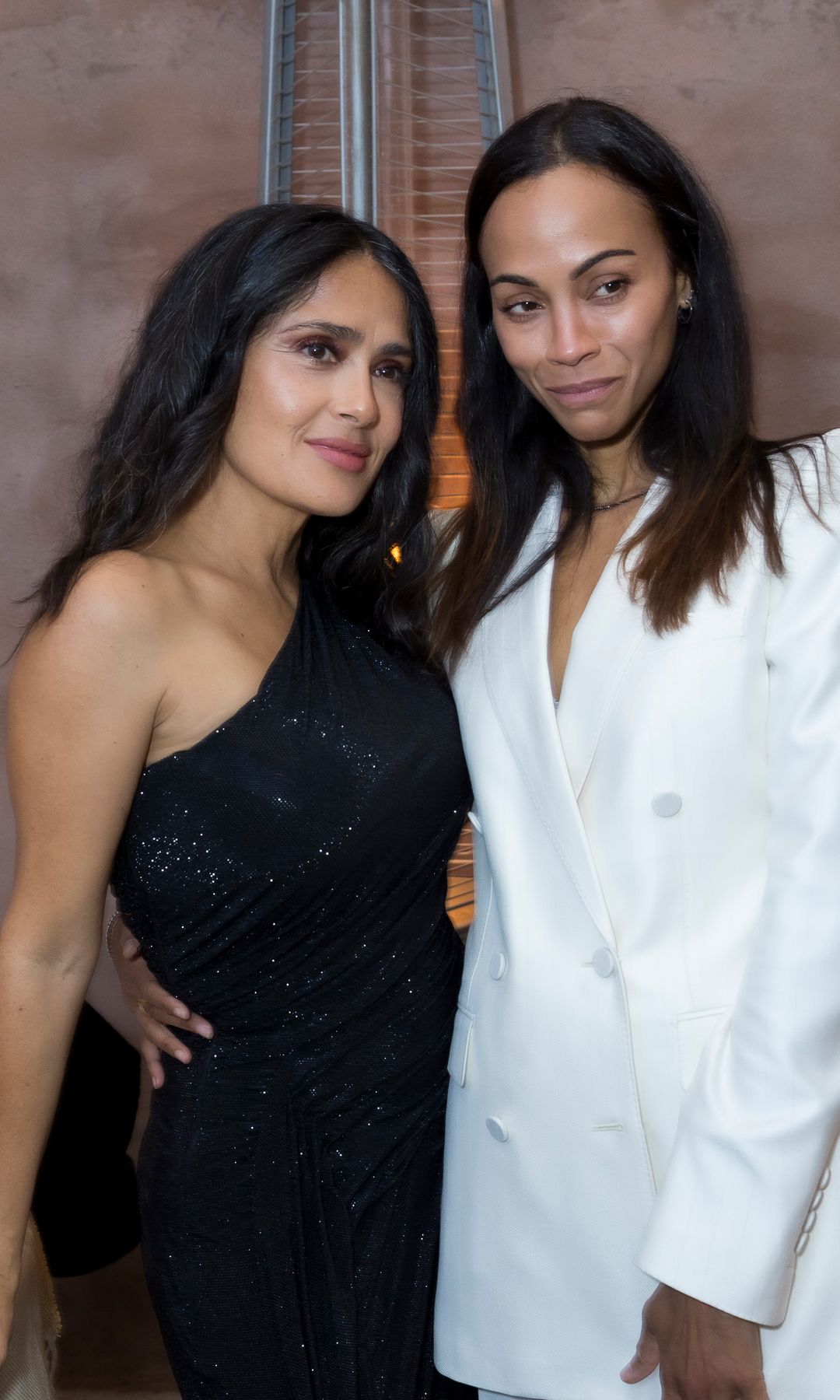 Salma Hayek and Zoe Saldaña turn heads on glamorous double date in Venice with contrasting fashion looks