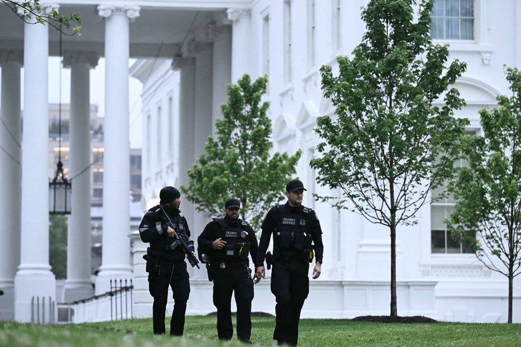 Secret Service agents are seen after a lockdown was lifted at the White House
