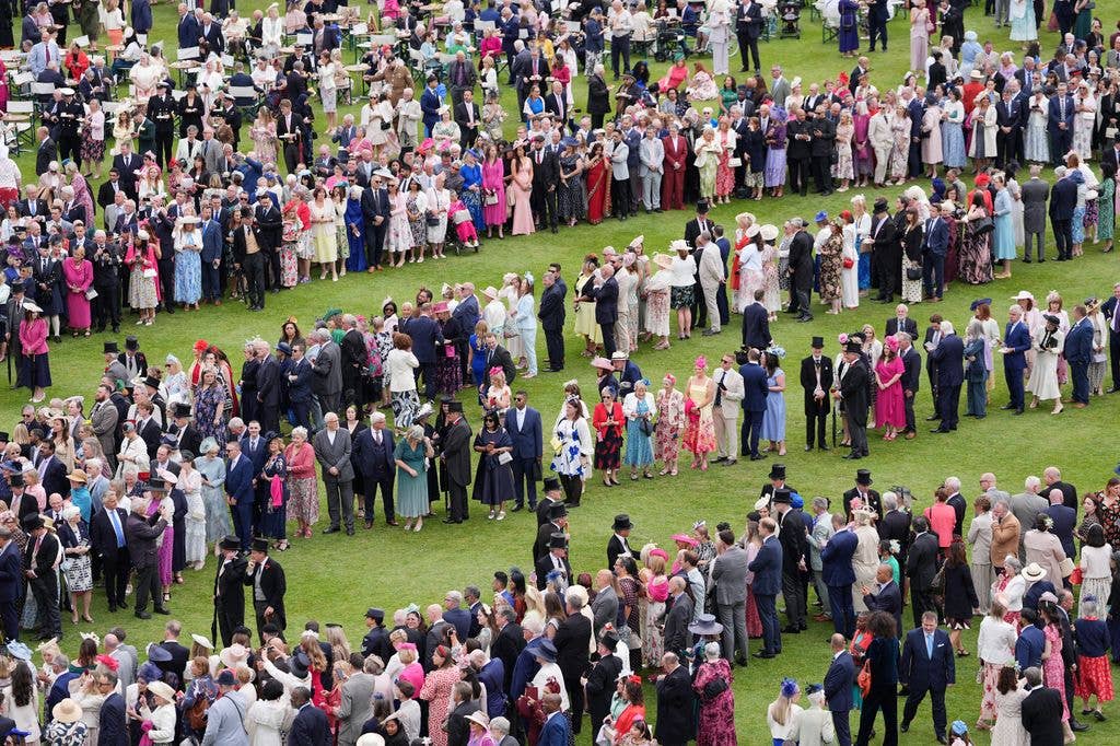 King Charles III and Queen Camilla at the garden steps before the start of a Royal Garden Party at Buckingham Palace on May 12, 2026 in London, England. The garden party celebrates frontline workers from across the United Kingdom and recognises the dedication and contribution of those who serve their communities through volunteering, supporting charitable causes and working for emergency services. (Photo by Yui Mok - WPA Pool/Getty Images)