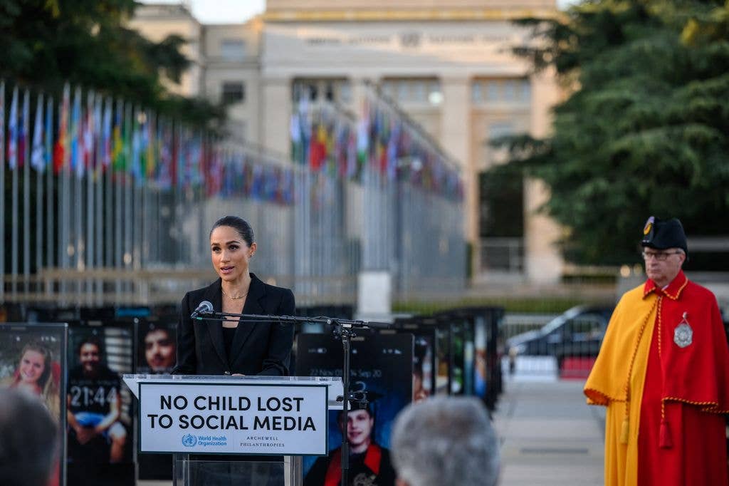 Britain's Meghan, the Duchess of Sussex delivers a speech at the opening of the "Lost Screen Memorial", an art installation of giant illuminated smartphones representing 50 children who tragically lost their lives following harm linked to social media, displayed at Place des Nations, ahead of the 79th World Health Assembly in Geneva, on May 17, 2026.