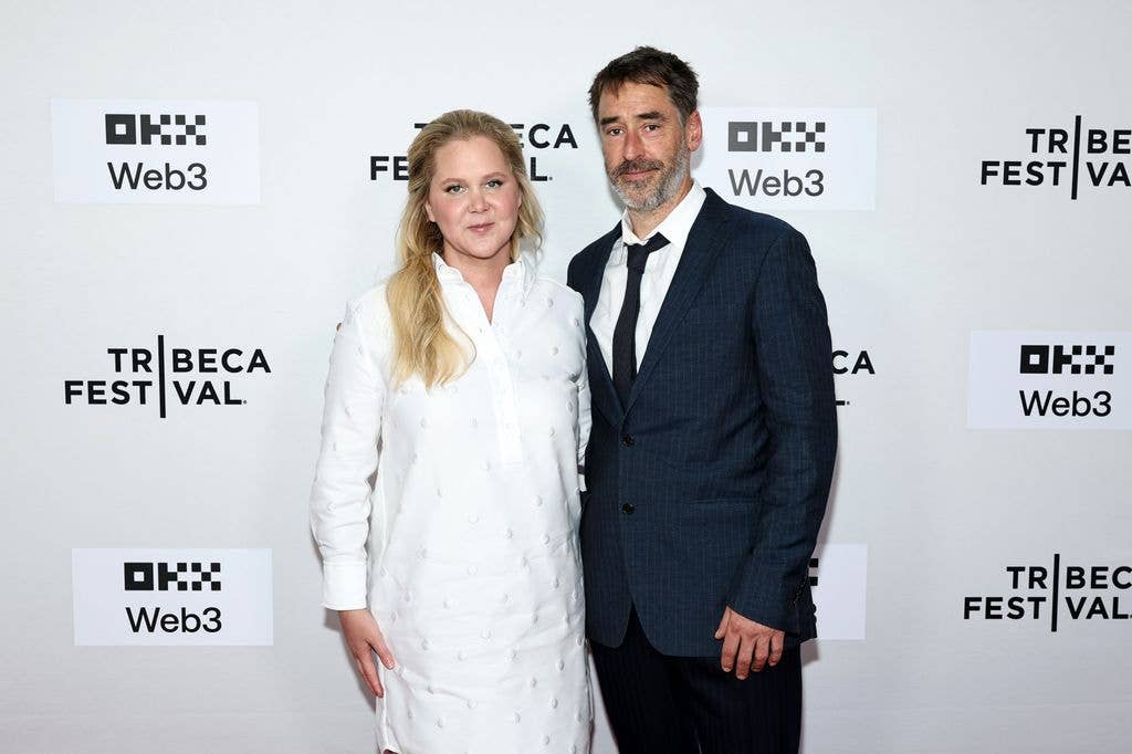 Amy and her then-husband, Chris Fischer, attend the "Room To Move" premiere 