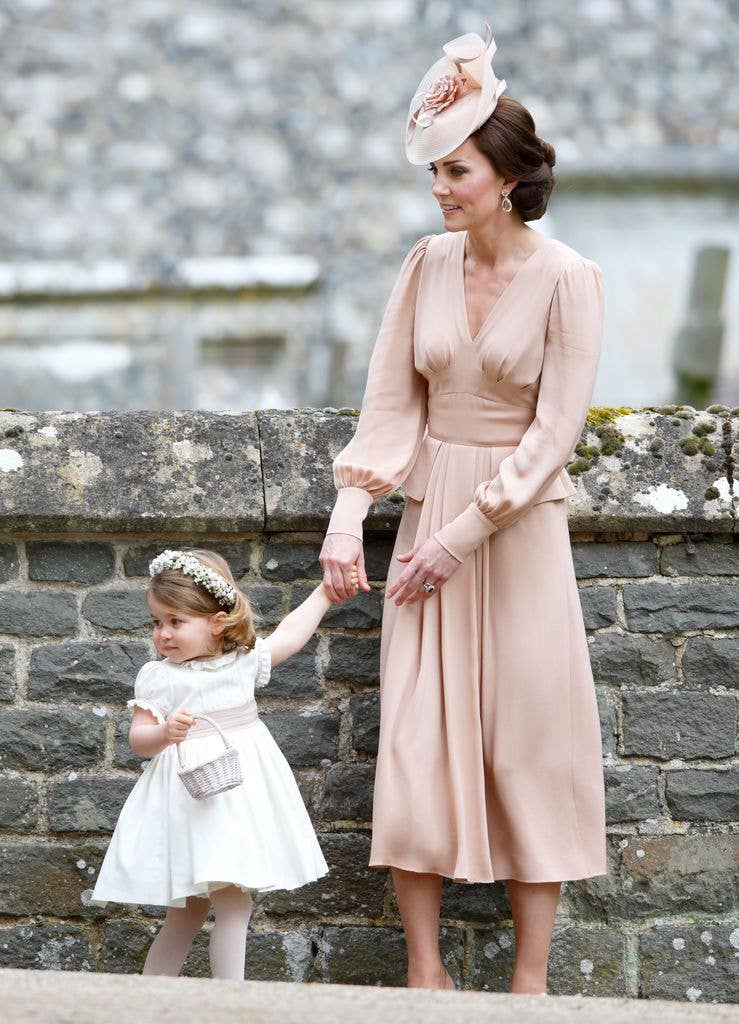 Catherine, Duchess of Cambridge and Princess Charlotte of Cambridge attend the wedding of Pippa Middleton and James Matthews at St Mark's Church