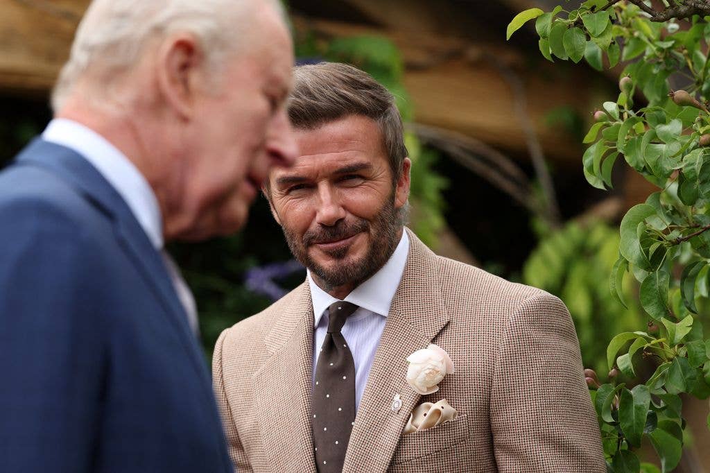 Former England footballer David Beckham smiles as Britain's King Charles III visits The RHS and The King's Foundation Curious Garden at the 2026 RHS Chelsea Flower Show in London on May 18, 2026.