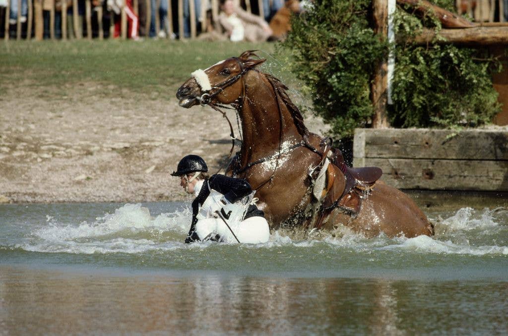 Princess Anne falling into the water with her horse at the 1982 Badminton Horse Trials