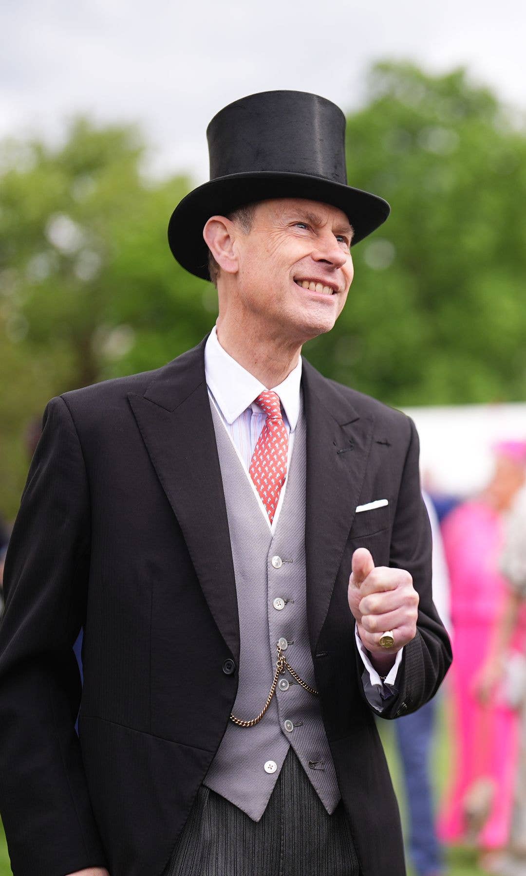 Prince Edward speaking to guests at a garden party