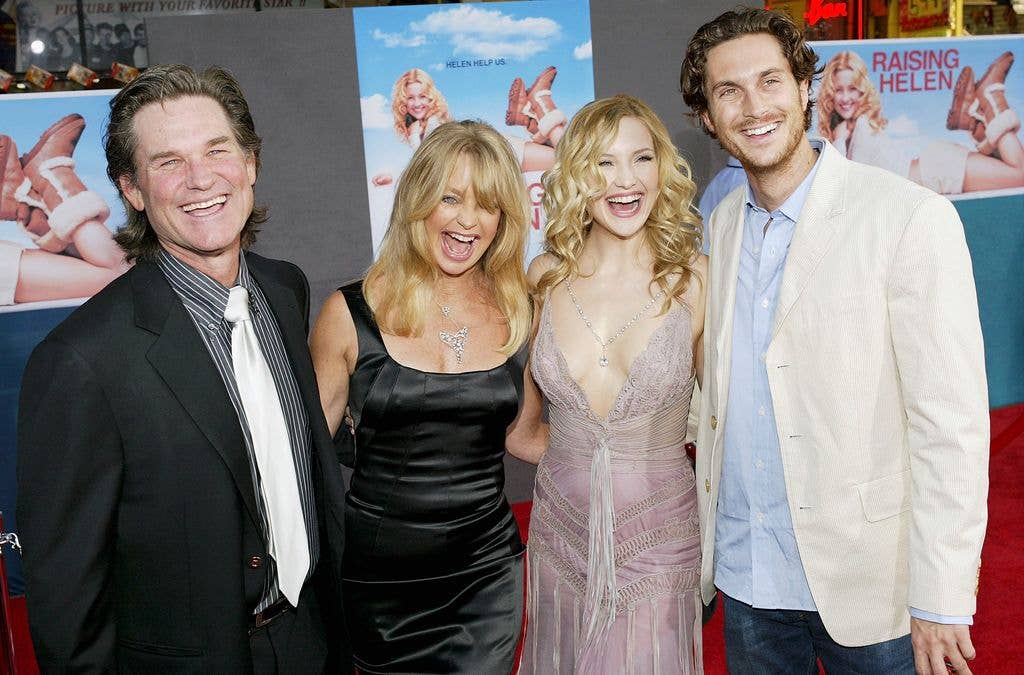 Actor Kurt Russell and his partner, actress Goldie Hawn, and her children, actress Kate Hudson and actor Oliver Hudson, attend the film premiere of the romantic comedy "Raising Helen" on May 26, 2004 at the El Capitan Theatre, in Hollywood, California.