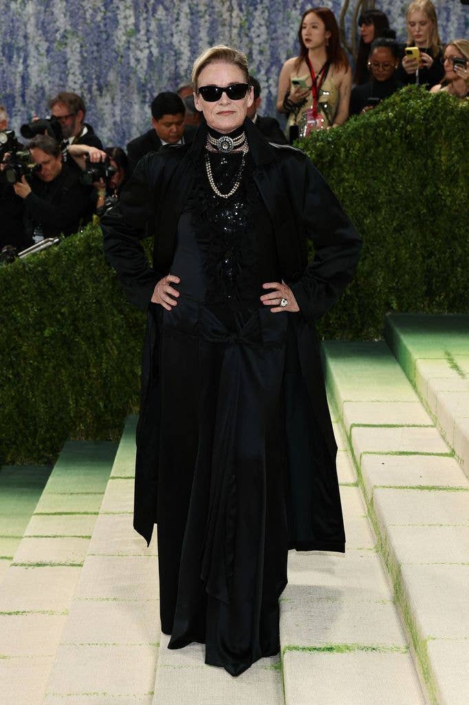 Lisa Love wears a black  coat and incredible jewellery