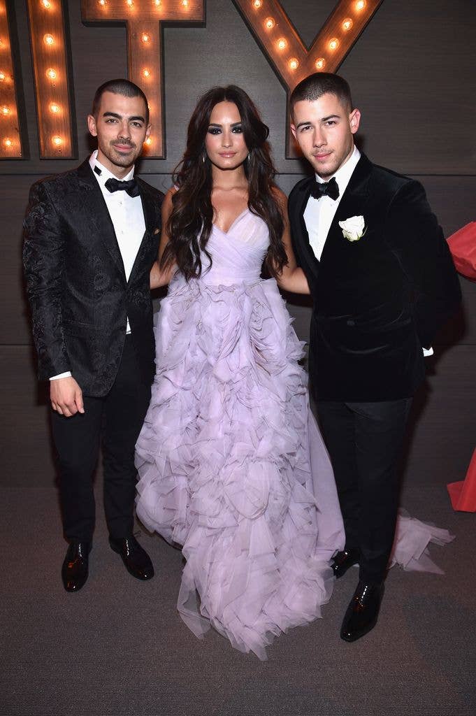Joe Jonas, Demi Lovato and Nick Jonas at the 2017 Vanity Fair Oscar Party