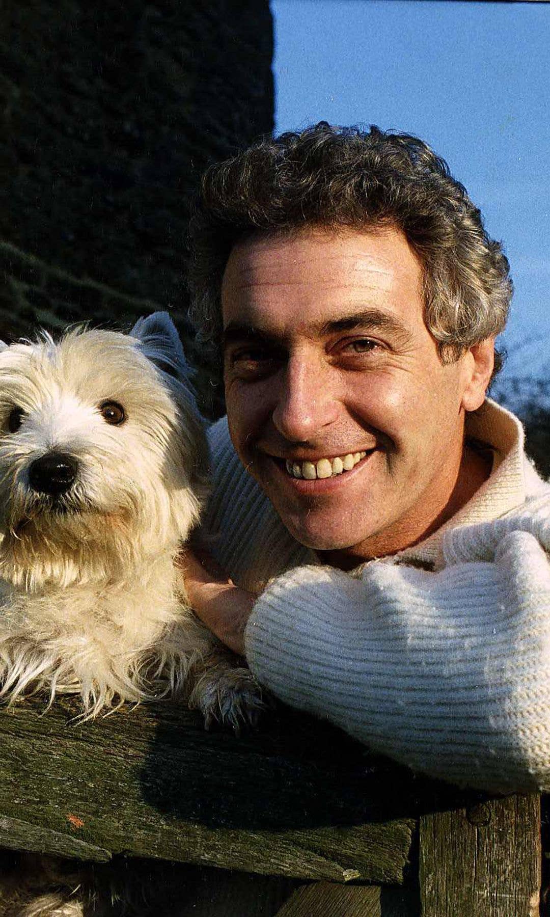 James Hazeldine with a white dog