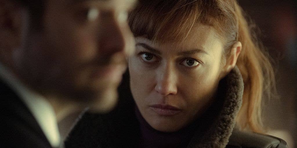 Olga Kurylenko and Charlie Cox in a still from Treason