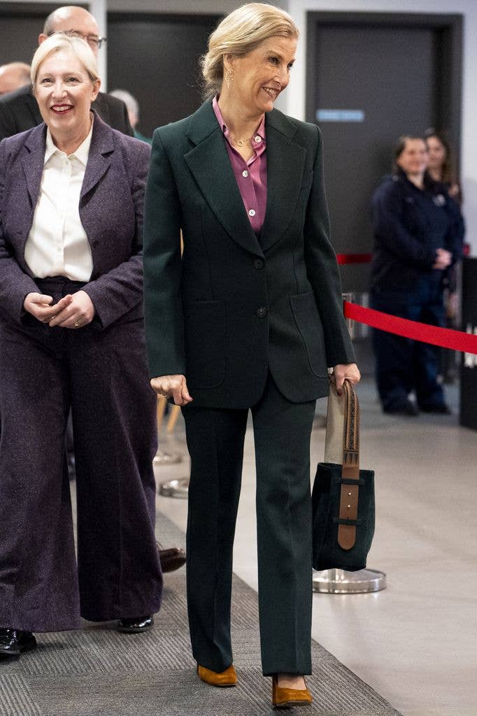 The Duchess of Edinburgh smiling in green suit