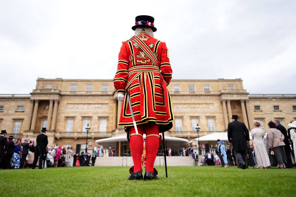 The King's Body Guard of the Yeomen of the Guard work during a Royal Garden Party at Buckingham Palace, in London, on May 12, 2026