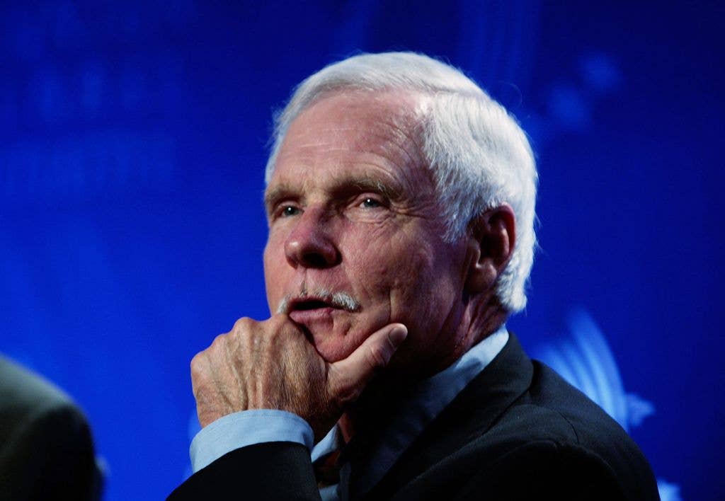 ted turner hand on cheek