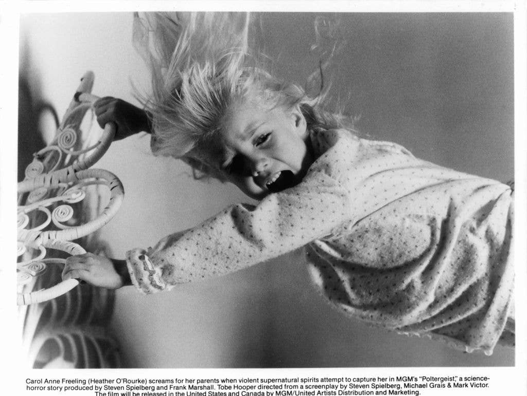 Evil spirits attempt to capture Heather O'Rourke in a scene from 'Poltergeist'.