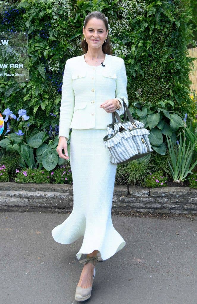 Jade Holland Cooper wears a pale green top and matching midi skirt