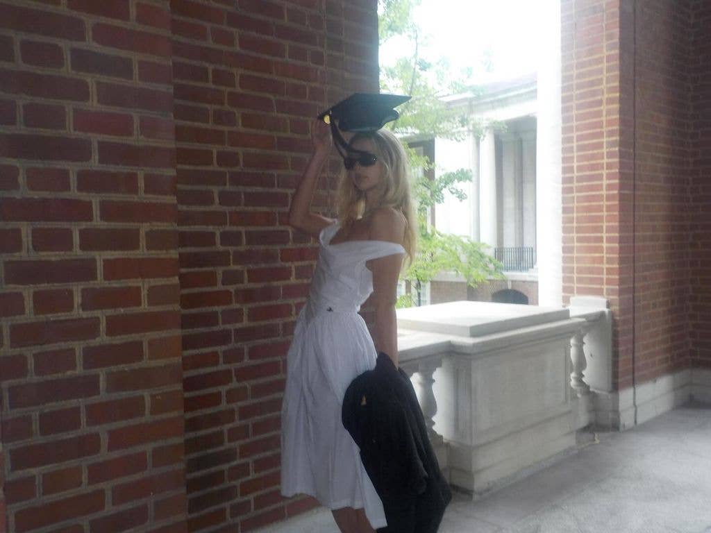 photo of apple martin in white dress with graduation cap