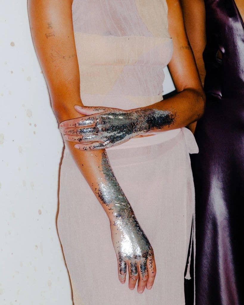 model with glitter on hands