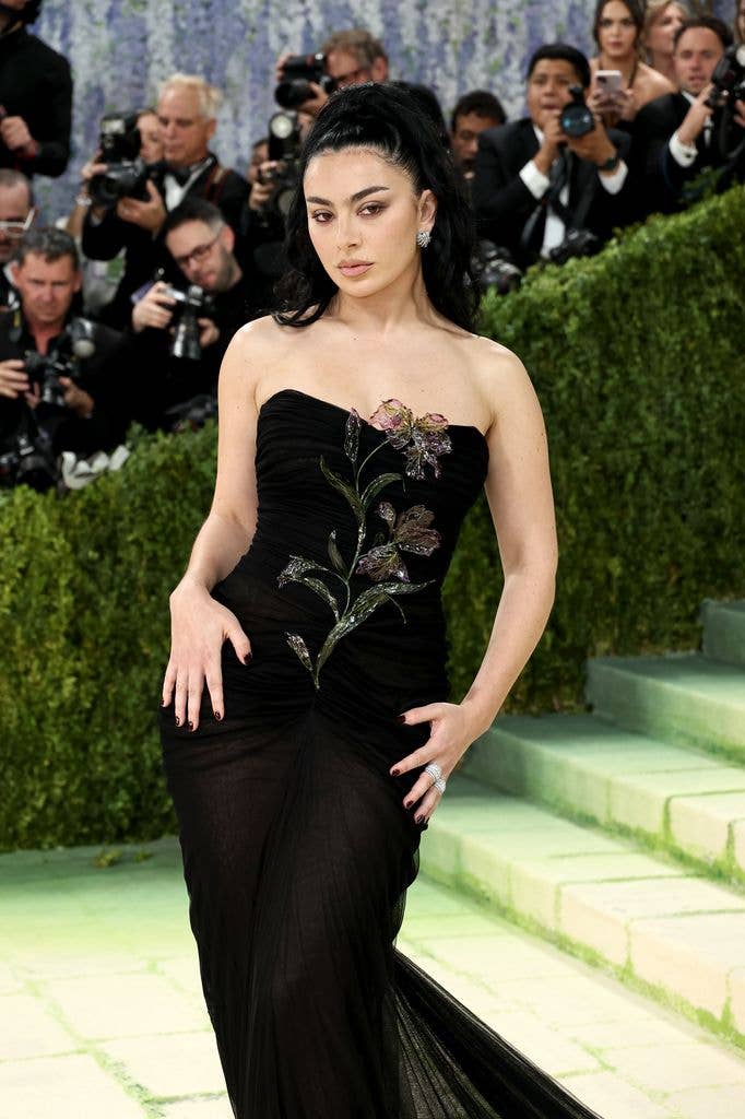 : Charli xcx attends the 2026 Met Gala celebrating "Costume Art" at the Metropolitan Museum of Art  in floral gown