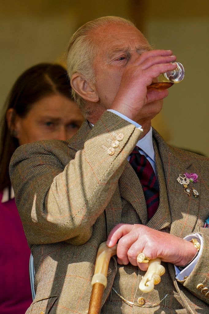 King Charles drinking whisky