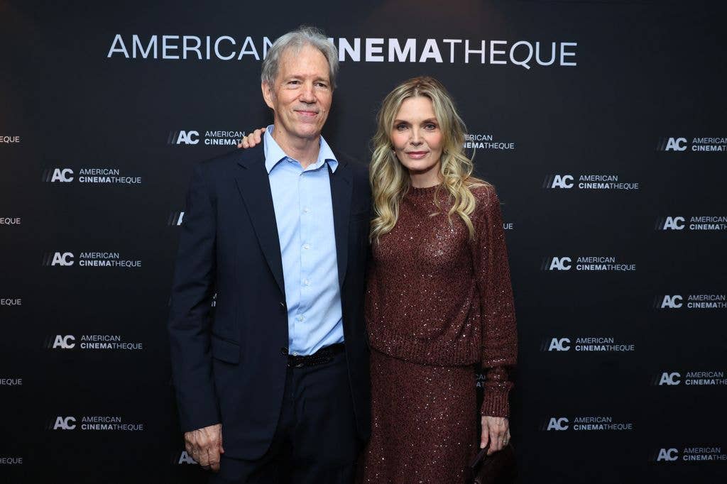 photo of michelle pfeiffer and david e kelley on red carpet