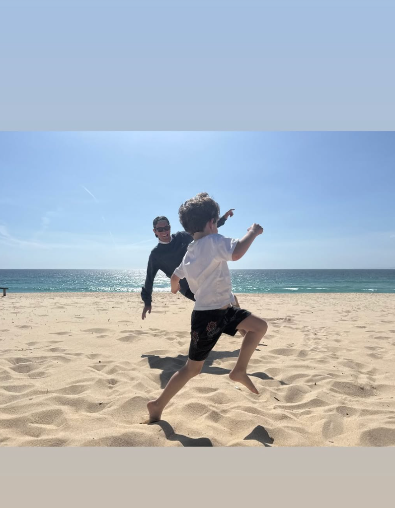 Jack playing with son on the beach