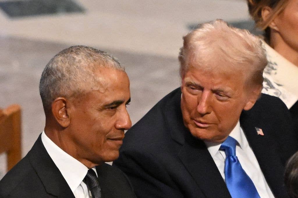 Donald Trump speaks with former President Barack Obama