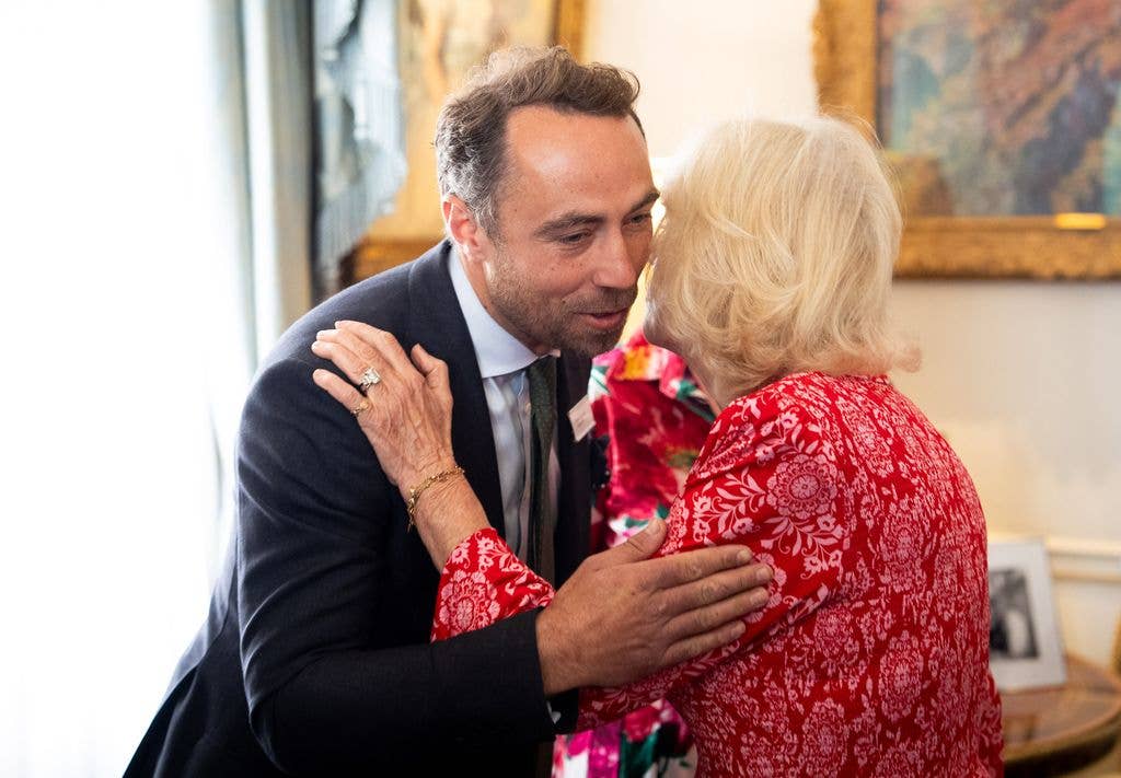 Queen Camilla, Patron of Medical Detection Dogs (MDD) shares kiss with James Middleton during a reception to celebrate the charity at Clarence House on May 12, 2026