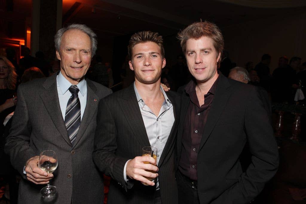 Clint Eastwood poses with sons Scott and Kyle at a film premiere.