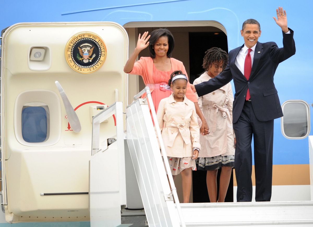 US President Barack Obama along with his wife Michelle and daughters Sasha and Malia arrive in Moscow on July 6, 2009. 