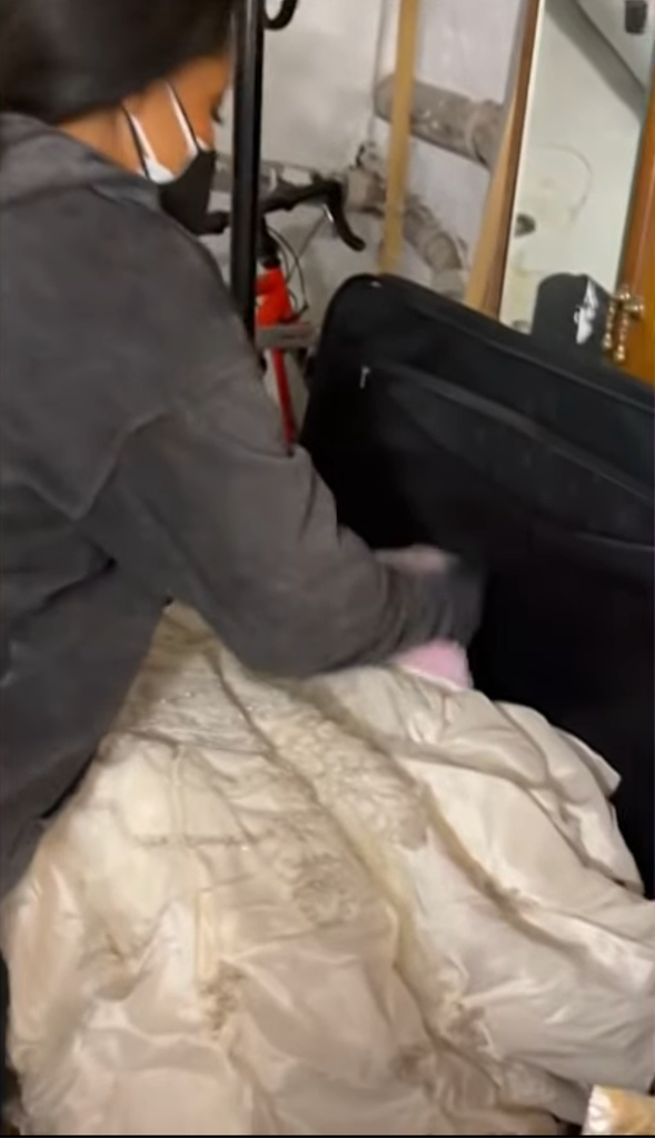 Still shared on TODAY with Jenna & Sheinelle Thursday, May 14, 2026 of her pulling out her wedding dress during her move