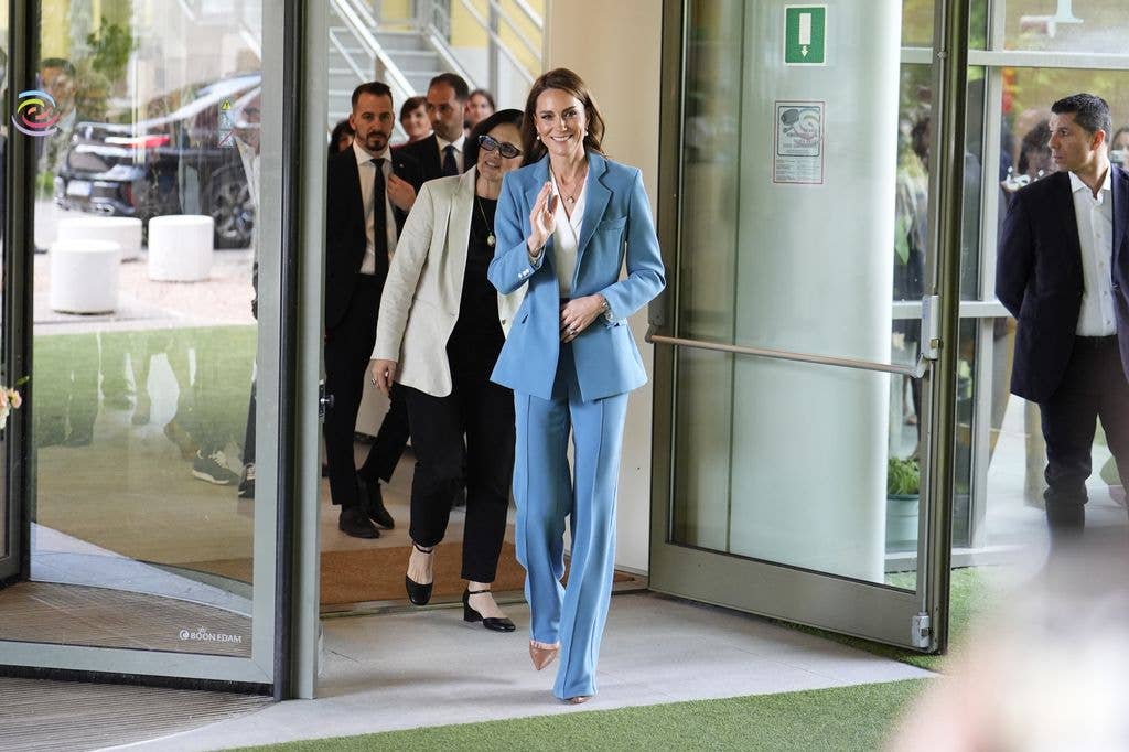 Princess Kate waving in blue suit