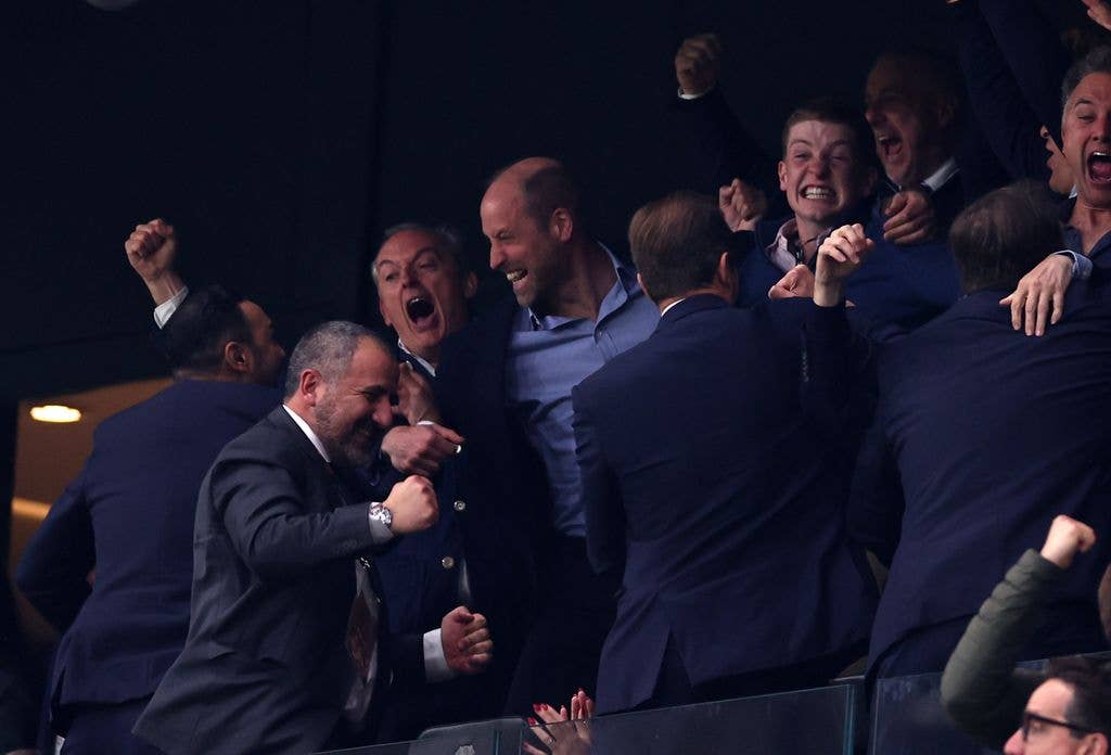 Prince William celebrating with a crowd