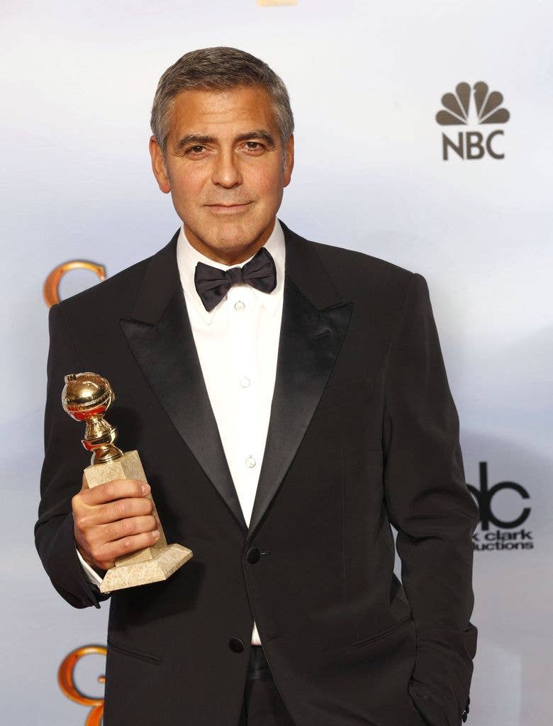 George Clooney in suit in the press room during the 69th Annual Golden Globe Awards 