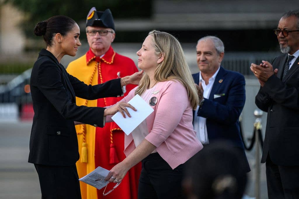 Britain's Meghan, the Duchess of Sussex delivers a speech at the opening of the "Lost Screen Memorial", an art installation of giant illuminated smartphones representing 50 children who tragically lost their lives following harm linked to social media, displayed at Place des Nations, ahead of the 79th World Health Assembly in Geneva, on May 17, 2026. (Photo by Fabrice COFFRINI / AFP via Getty Images)