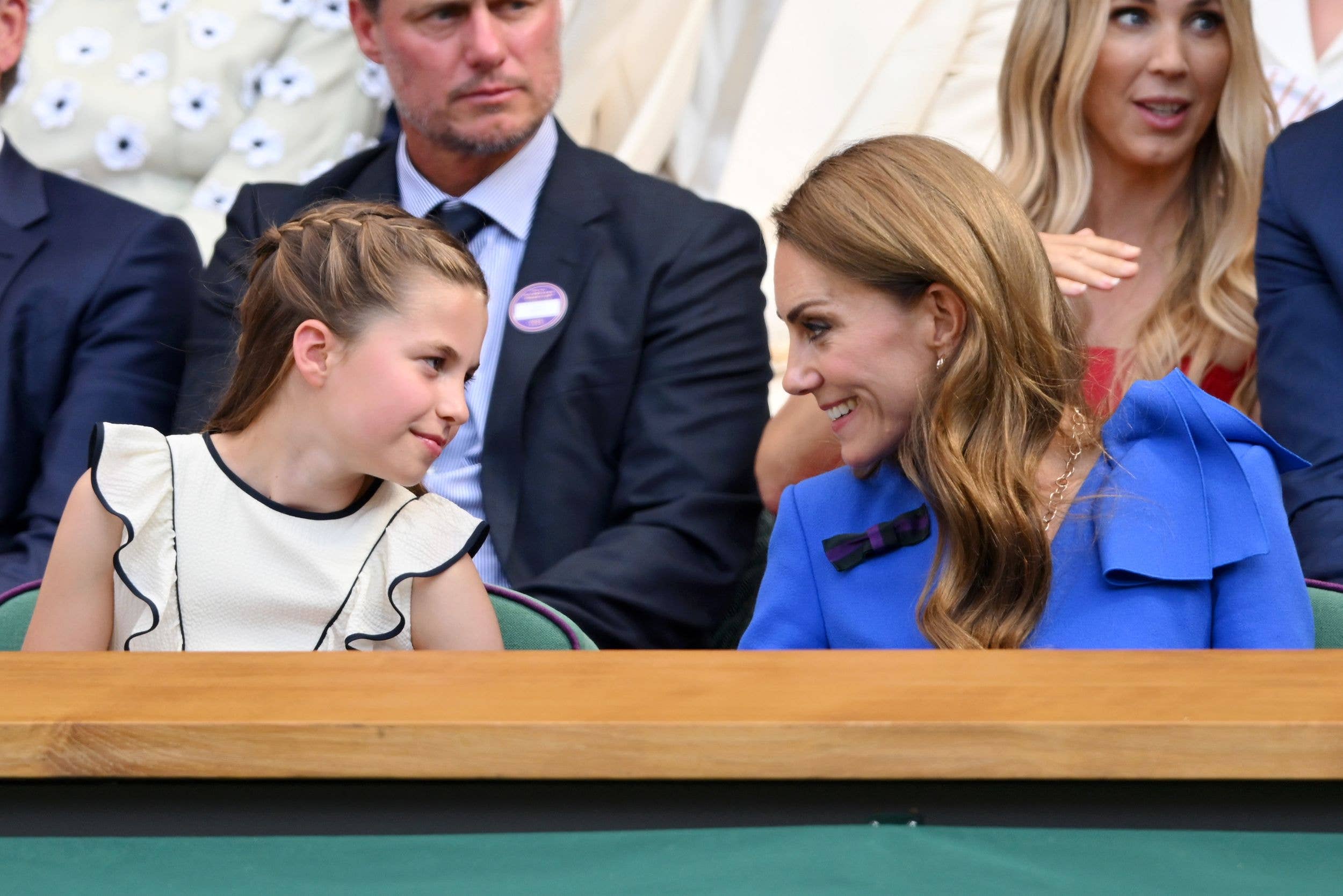 Kate and Charlotte smiling at each other at Wimbledon