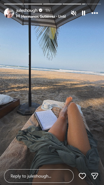 The dancer enjoyed a book and drink beachside