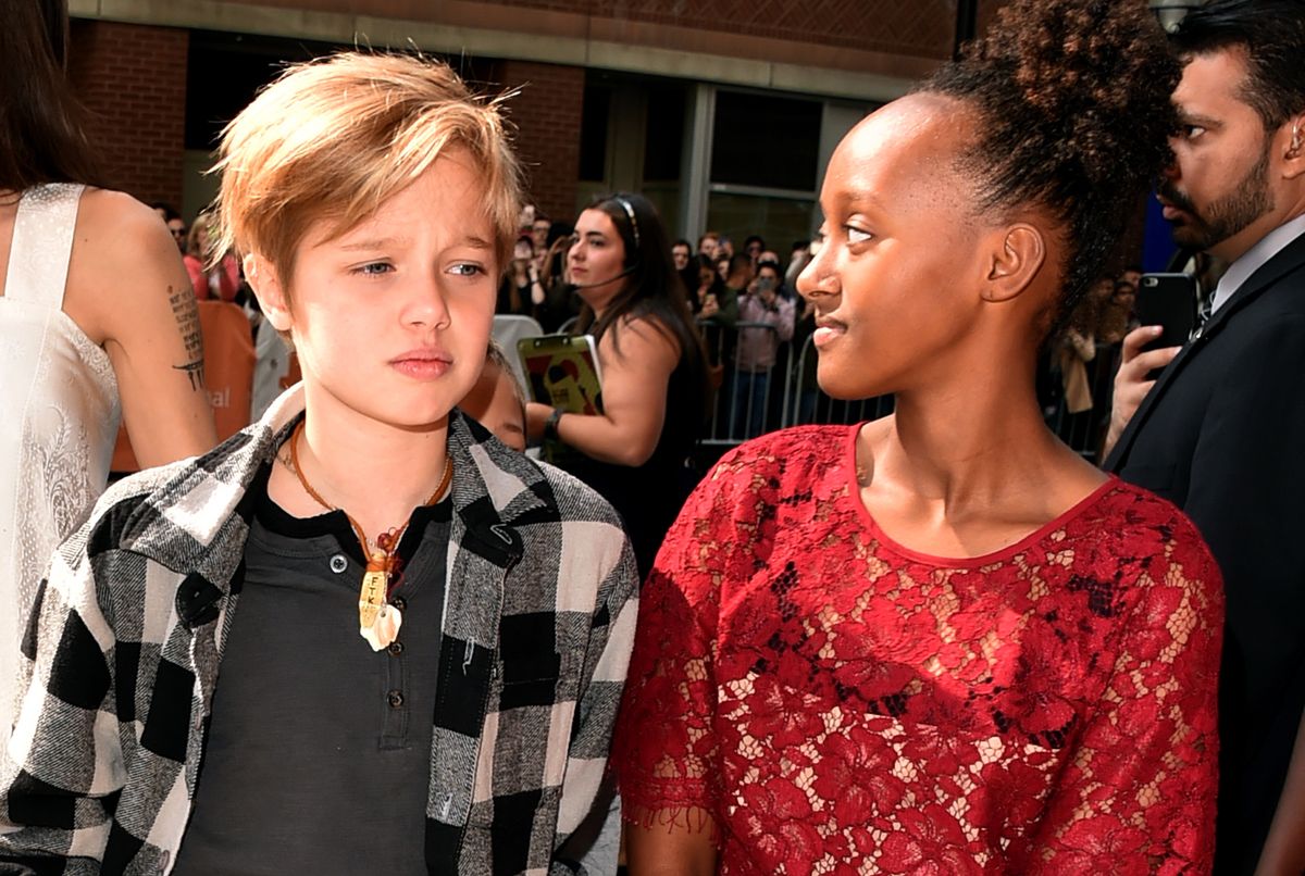 A few years later, in 2017, she was photographed at the Toronto International Film Festival, at the premiere of "The Breadwinner." For the occasion, Shiloh wore a shorter haircut, a black shirt, and a black and white plaid shirt.